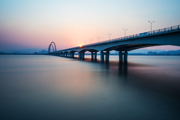 Fototapeta na wymiar sunrise,sunset skyline and bridge over river
