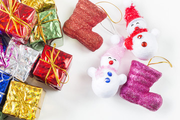 Snowman and gift box and shoe christmas selective focus