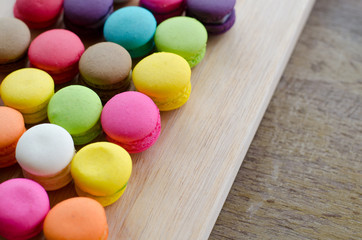 Colourful tasty macaroons in a row