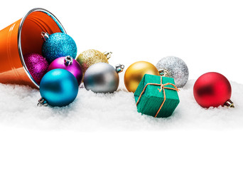 Christmas balls and gifts on snow isolated
