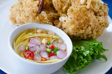 Crispy catfish salad with spicy sauce, Thai food