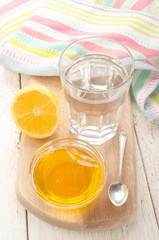 hot water in a glass with lemon and sweet honey