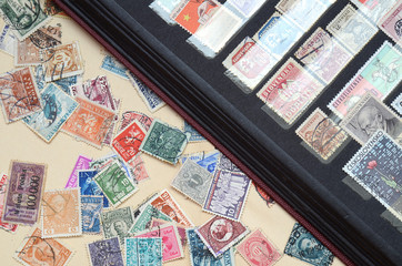 Fototapeta na wymiar Album with old postage stamps