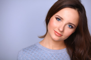Fototapeta premium Portrait of an attractive fashionable young brunette woman