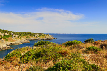 SUMMER LANDSCAPE.Salento coast: Bay Uluzzo (Lecce). - ITALY (Apulia) -Mediterranean maquis:in the...