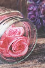 Obraz na płótnie Canvas Vintage roses on the jar