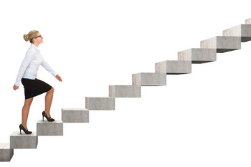 Business woman walking up a staircase. Isolated on white
