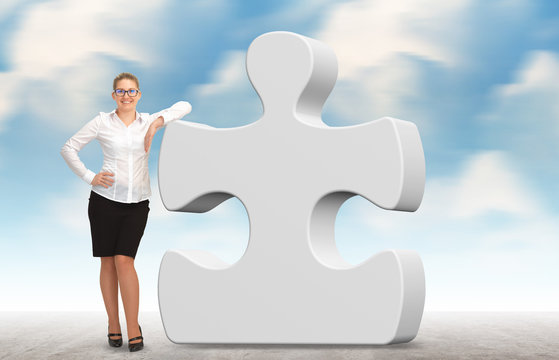 business woman building a puzzle on a sky background
