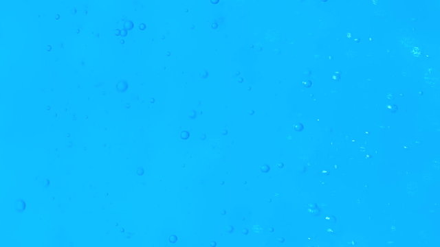 Slowmotion Perfect Bubbles in Water Accending to the Surface