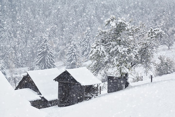 snow blizzard in mountain settlement