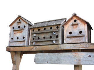 Obraz na płótnie Canvas Old wooden starling nesting boxes bird house isolated over white