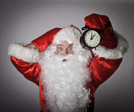 Santa Claus and a clock