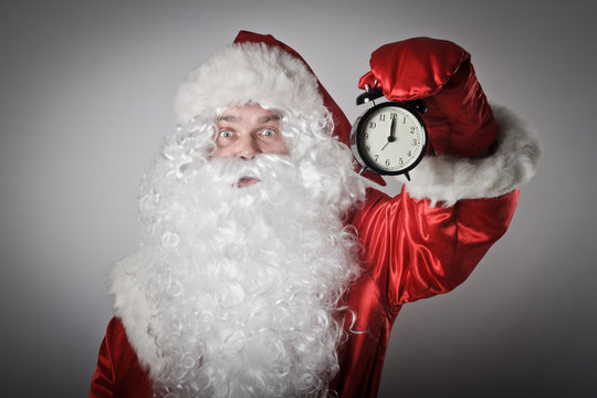Santa Claus and a clock