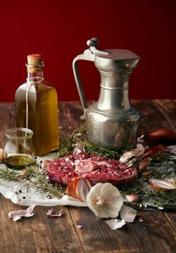 Food: onions, romero, meat steak, salt, pepper, garlic, olive oi