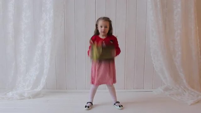 Girl Jumping with Gift Box