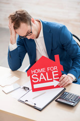 Estate agent is waiting for clients without results