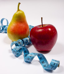 Apple, pear and tape measure, diet concept