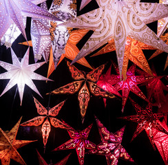 Colorful Christmas stars.  A background of star lanterns.