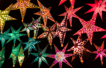 Colorful Christmas stars.  A background of star lanterns.