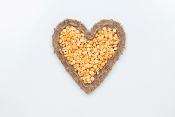 Peas lies at the heart made of burlap