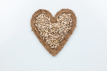 Sunflower seeds  lies at the heart made of burlap