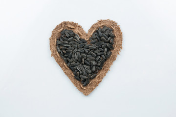 Sunflower seeds  lies at the heart made of burlap