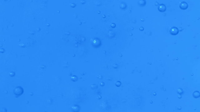 Slowmotion Perfect Bubbles in Water Accending to the Surface