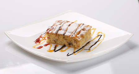 piece of apple pie decorated with caramel