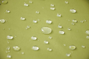 Fototapeta na wymiar Waterproof coating textile, background with water drops.