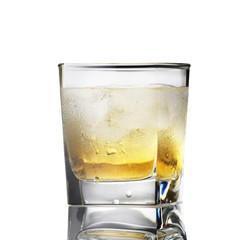 whiskey with ice in a sweaty glass on a white background i