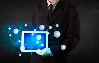 Young person holding talbet with communication technology concep