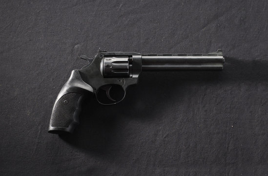 revolver on black background