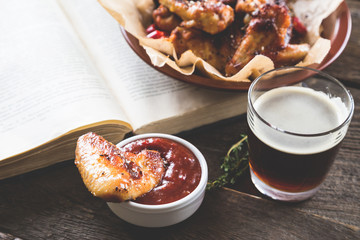 Roasted chicken wings and dark beer