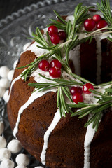 Xmas cake decorated rosemary and cranberries