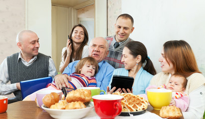  family  with various electronic communication devices