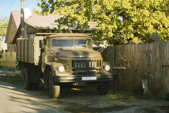 Village Rustic Truck Near The Fence At Sunny Day, Autumn Season.