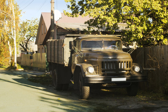 Village Rustic Truck Near The Fence At Sunny Day, Autumn Season.