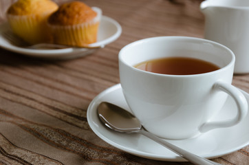 White Cup of Tea and Cup Cake for Tea Break.