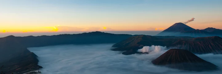 Tuinposter Stunning Sunset and Layer of Mist at volcano Bromo © attiarndt