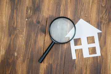 paper house with Magnifying Glass, House hunting