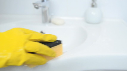 woman doing chores in bathroom at home