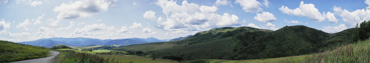 Fototapeta na wymiar Mountain panorama with the road