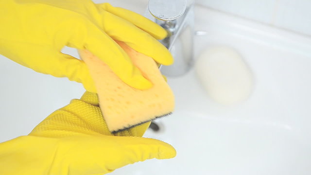 woman doing chores in bathroom at home