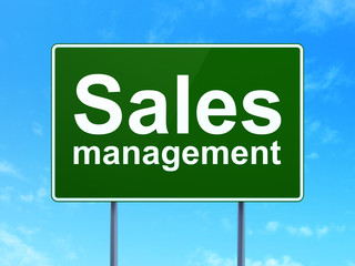 Advertising concept: Sales Management on road sign background