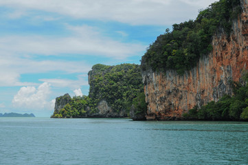 The Ochre Colours of the Rock Glow in Reds and Browns. Islands at Phang Nga Bay near Krabi and...