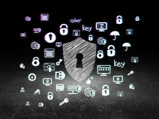 Safety concept: Shield With Keyhole in grunge dark room