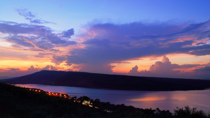 Dramatic sunset over lake at Lam Ta Khong Reservoir, Nakhon Ratchasima province, Thailand.