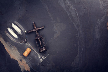 Wine glass and corkscrew