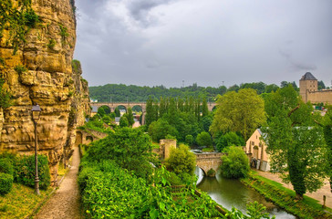 Fototapeta na wymiar River with houses and bridges in Luxembourg, Benelux, HDR