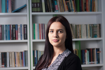 Young female student in library